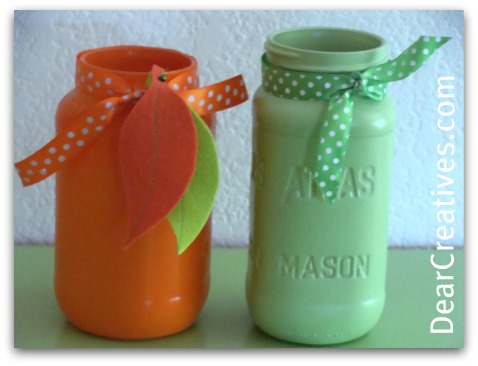 Mason jars decorated with felt leaves and polka dot ribbons for fall - Easy mason jar crafts for fall and Halloween at DearCreatives.com