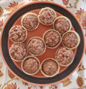 Carrot muffins on a plate after baking. This carrot muffins recipe has apples. Grab this carrot apple muffins recipe at DearCreatives.com