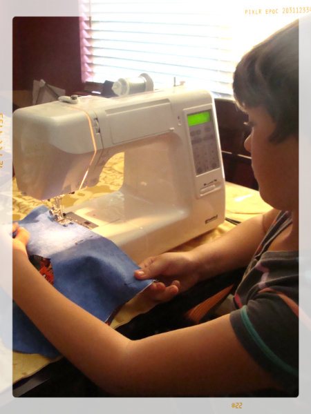 my daughter learning to sew with supervision. kids craft sewing projects for a child learning to sew
