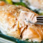 Baked Salmon_Salmon on a fork_flaky delicious easy to make salmon that is baked in the oven. Perfect for meatless Mondays, any night or to impress your guests. Serve with rice, salad, or your favorite vegetables.