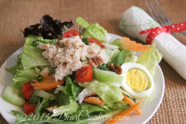 Salad on a plate with napkin and fork_