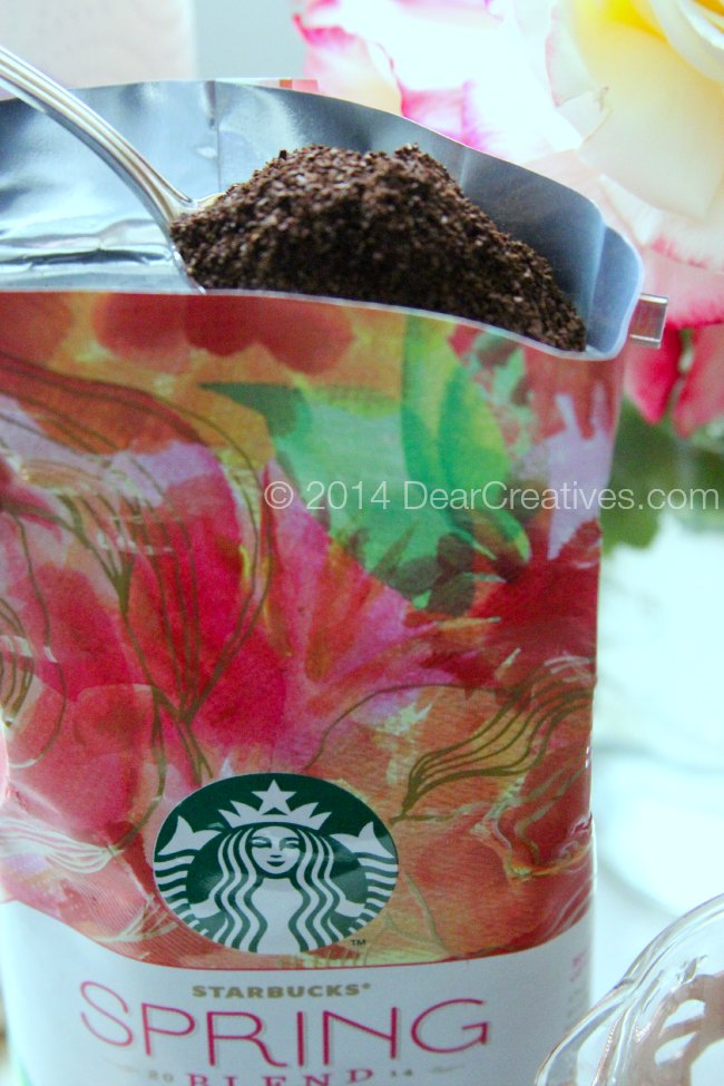 Coffee being scooped out of a coffee bag with a spoon_ Coffee grounds on a spoon_