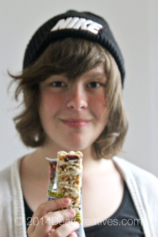 Girl holding a yogurt granola bar_