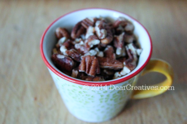 chopped pecans in a measuring cup_