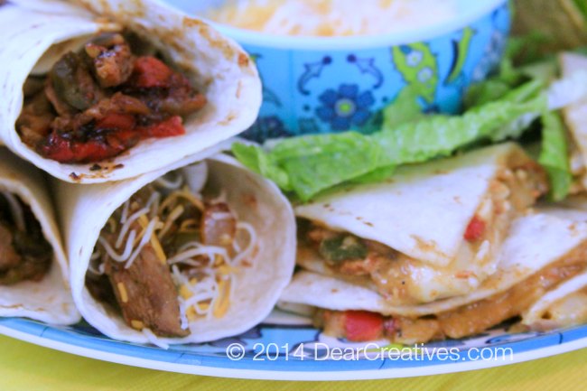 close up of steak fajitas and chicken quesadillas _