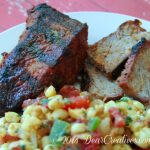 teak and steak slices with corn salsa on a plate_