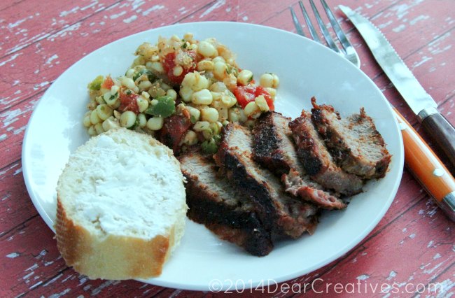 Corn Salsa on a plate with steak and bread