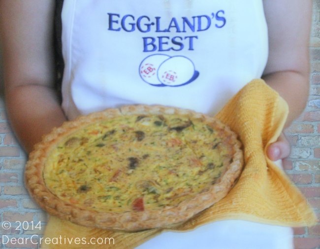 Holding a quiche with a towel_