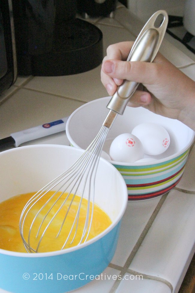 close up of eggs being whisked_