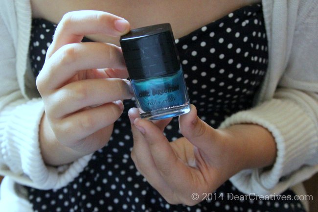 Nail Polish being held in hands_nail polish from One Direction Makeup Kit_