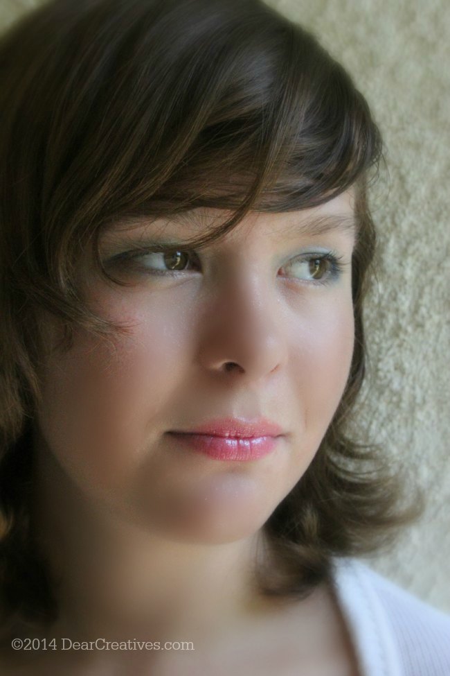 Teen with One Direction Makeup on with lip gloss_