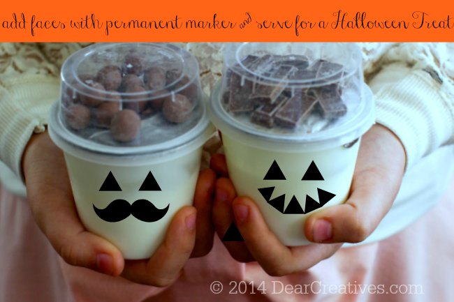 decorated Yogurt cups_ Halloween decorated yogurt cups_hands holding two types of Hersheys Yoplait Yogurt Cups
