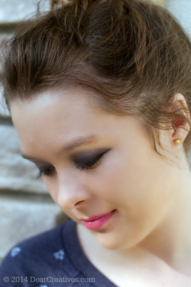 One Direction Limited Edition Holiday Make up on a young lady looking down_© 2014 DearCreatives.com