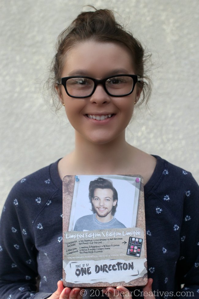 Young Lady holding One Direction Limited Edition Holiday Makeup Kit_© 2014 DearCreatives.com_
