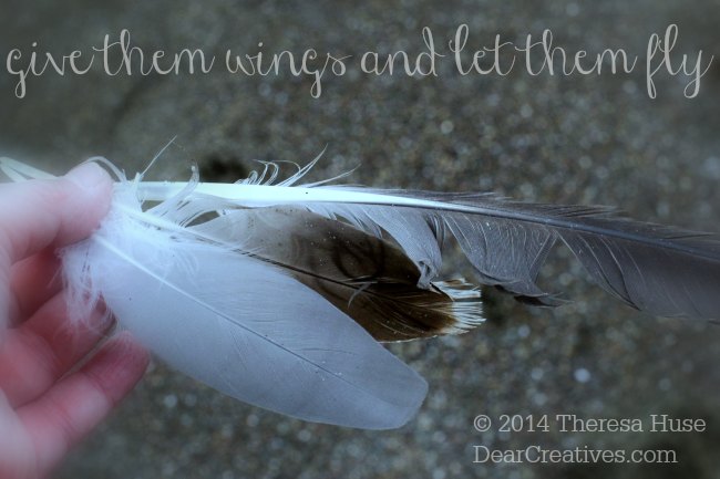 feathers in a hand_