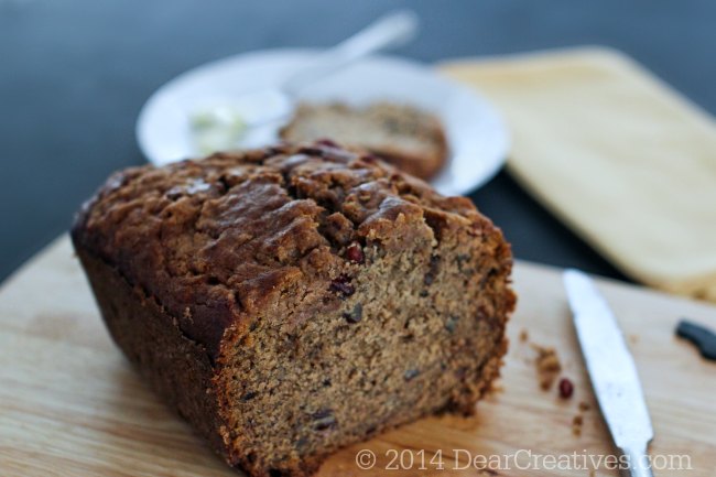 Banana Bread a knife on a cutting board with a slice of banana bread on a plate with butter_banana bread_© 2014 Theresa Huse_ DearCreatives.com