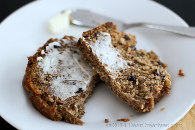 Banana Bread on a plate close up with a butter knife and butter_ slices of banana bread with butter_© 2014Theresa Huse DearCreatives.com