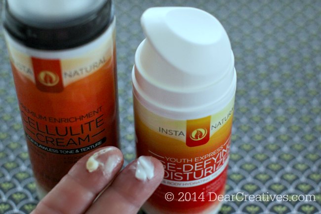 Cellulite Cream and Moisturizer on fingers_Insta Natural_Beauty Products_© 2014 DearCreatives.com