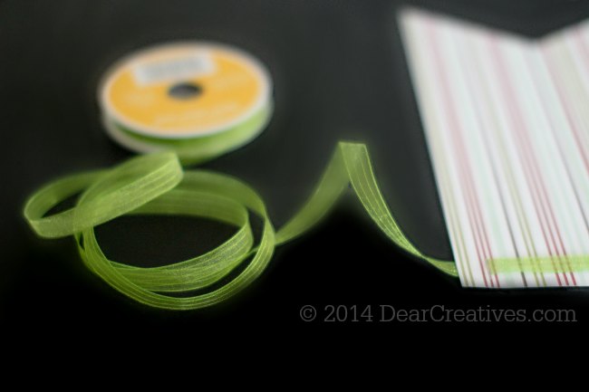 Stringing ribbon through the top of the banner_© 2014 DearCreatives.com