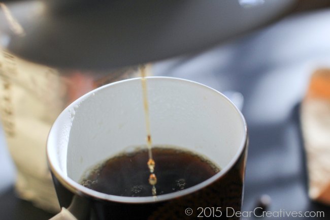 Checking the level of coffee in pour over brew