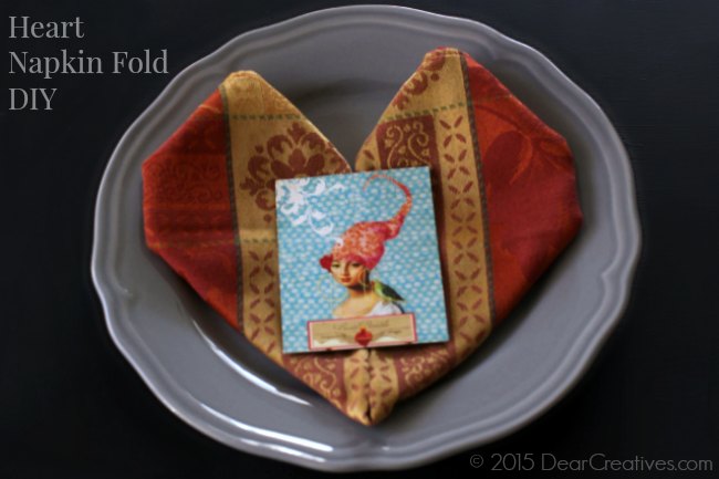 Heart Napkin fold | folded Heart Napkin on a plate 