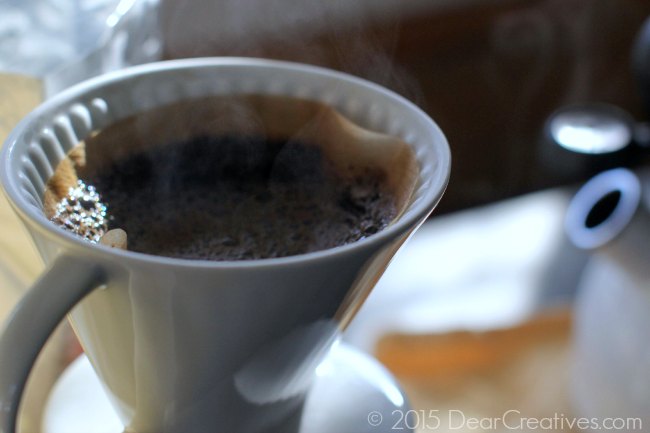 Melita Brewing Coffee_Coffee filter with coffee water and steam rising