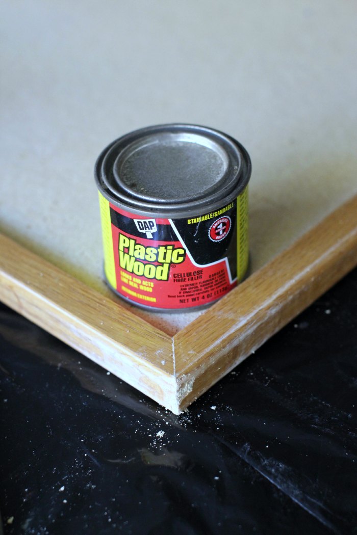 fixing a bulletin board with wood putty 