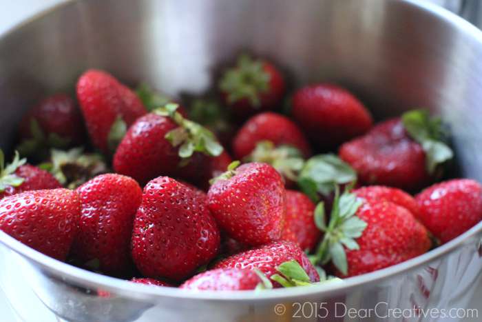 Strawberries in a stainless steel bowl