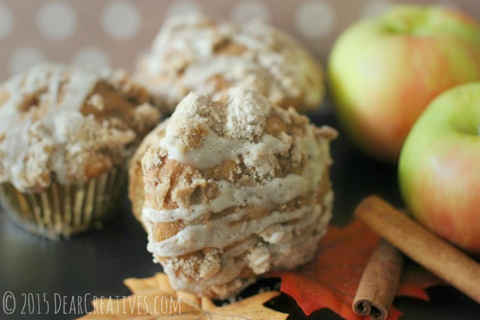 Apple Muffins and cinnamon sticks next to apples