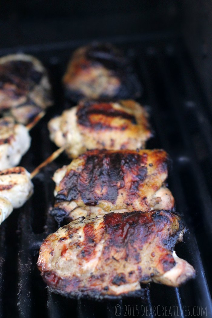 Chicken thighs on BBQ grill close up