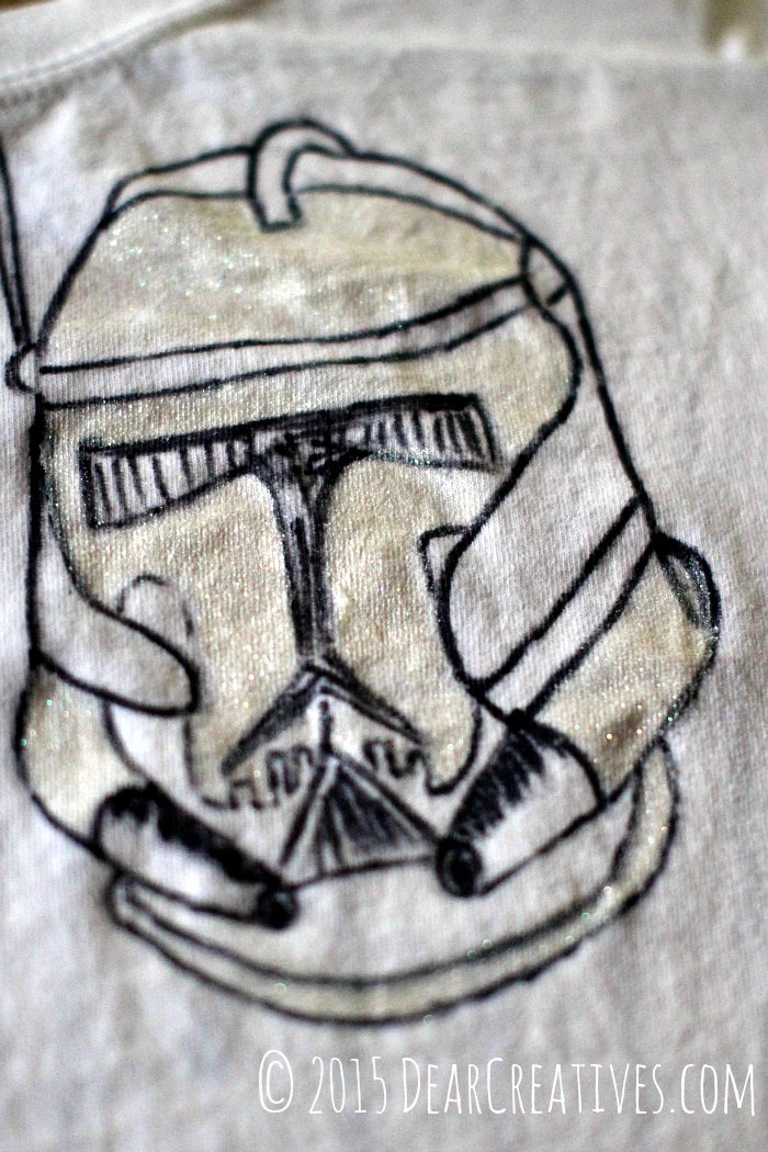 Close up of Storm Tropper Design on tee shirt being painted with fabric paints