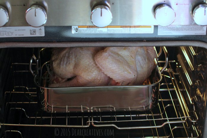 Turkey in a roasting pan in the oven