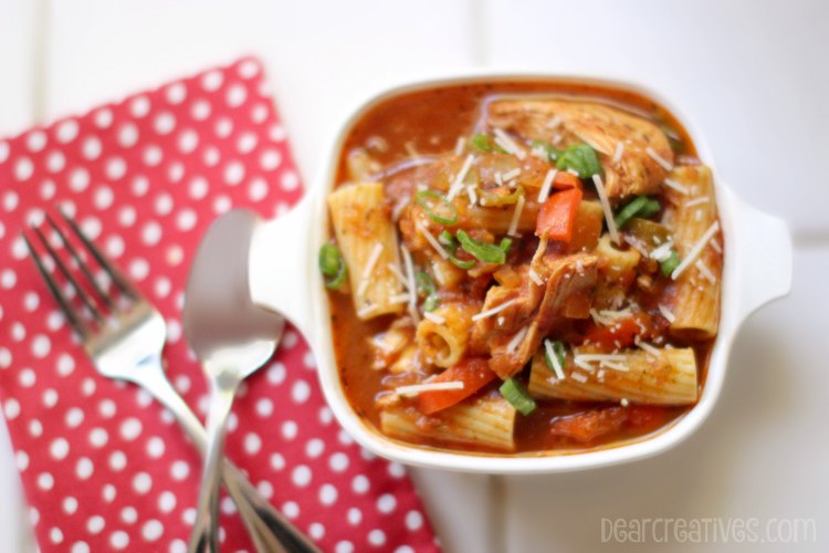 Easy Recipes Slow Cooker | Chicken Cacciatore In a Bowl next to a fork and spoon