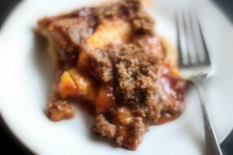 Peach Pie With Crumb Topping on a plate