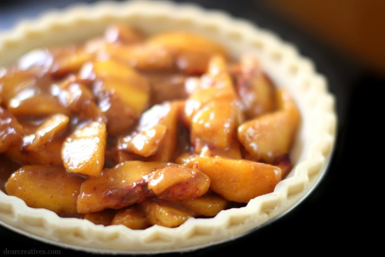 Peach pie ready for topping