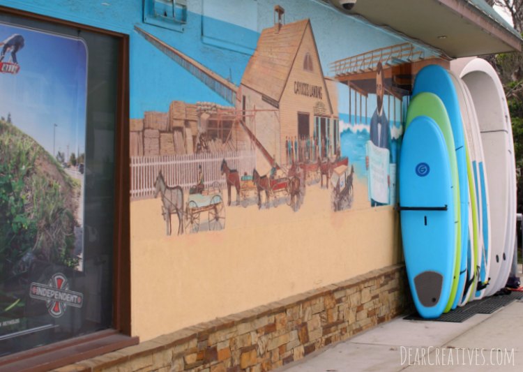 Travel California Side of Building at Surf Shop with mural Cayucos California