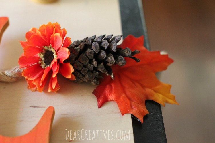 fall-banner-with-wood-letters-and-silk-flowers-on-rope-step-by-step-tutorial-that-anyone-can-make-close-up-of-banner-with-red-orange-flower