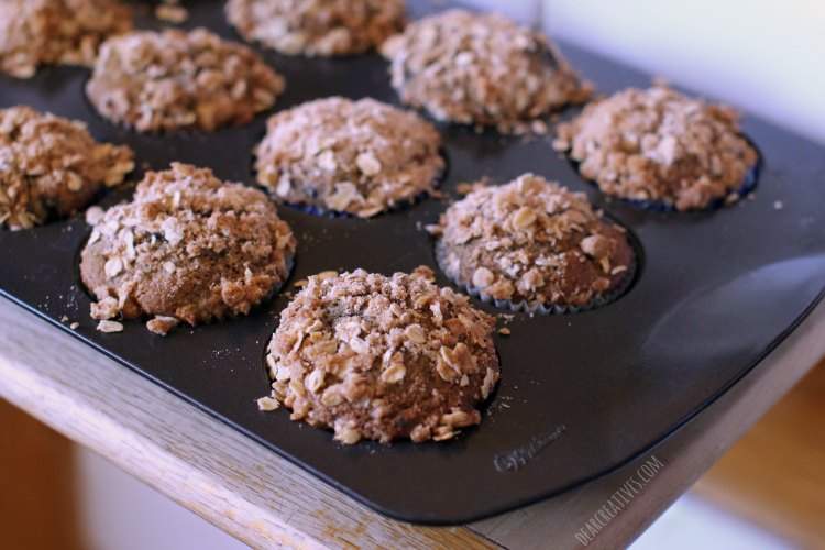 Blackberry peach muffins cooling on a wood cutting board - Blackberry Peach Muffins -This is an easy blackberry recipe that can be made at home with fresh fruit DearCreatives.com