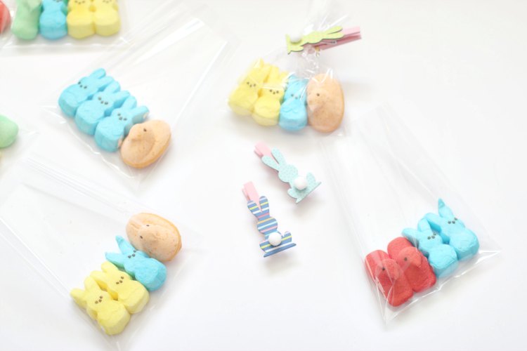 Fun and Easy DIYs Easter treats peepscandy treats Peeps Candy added to treat bags with a seasonal clothes pin closure. Fun and easy DIY.