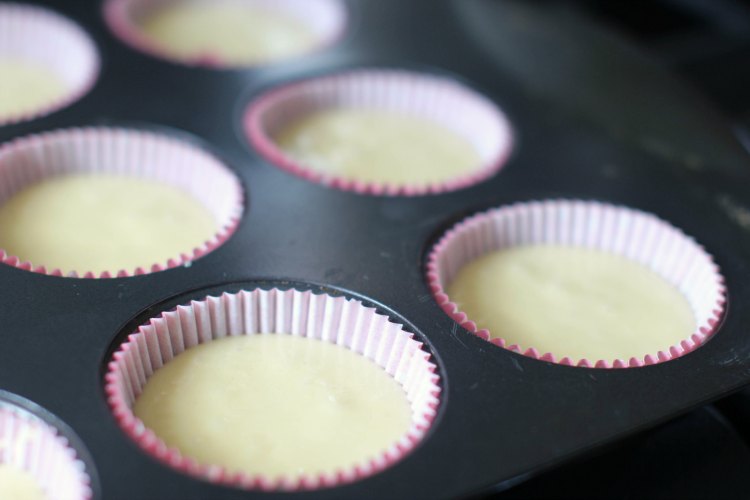 baking cupcake batter in cupcake liners 