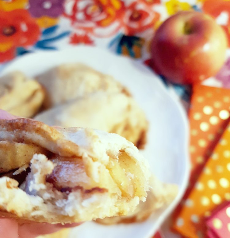 apple hand pie bakesd, and with bites taken out of it.