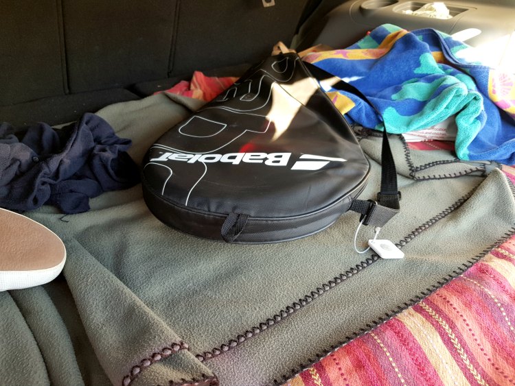 tennis racket with tile found on left in trunk of the car