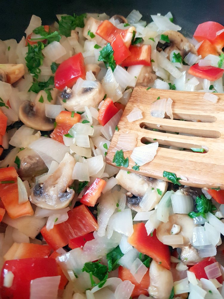 Sauteed onions, garlic, red pepper, and parsley for soup