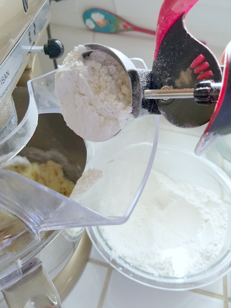 adding flour to make the snickerdoodle cookie dough DearCreatives.com