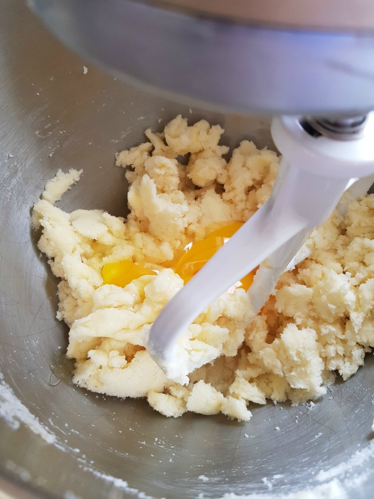 creamed butter, and sugar adding eggs, and vanilla to mix together in mixing bowl mixer DearCreatives.com