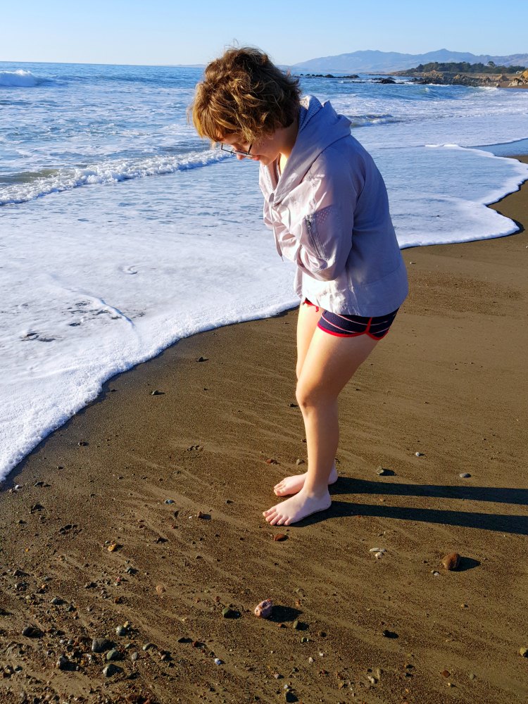 Searching for rocks, and shells along Moonstone beach Cambria, California - DearCreatives.com