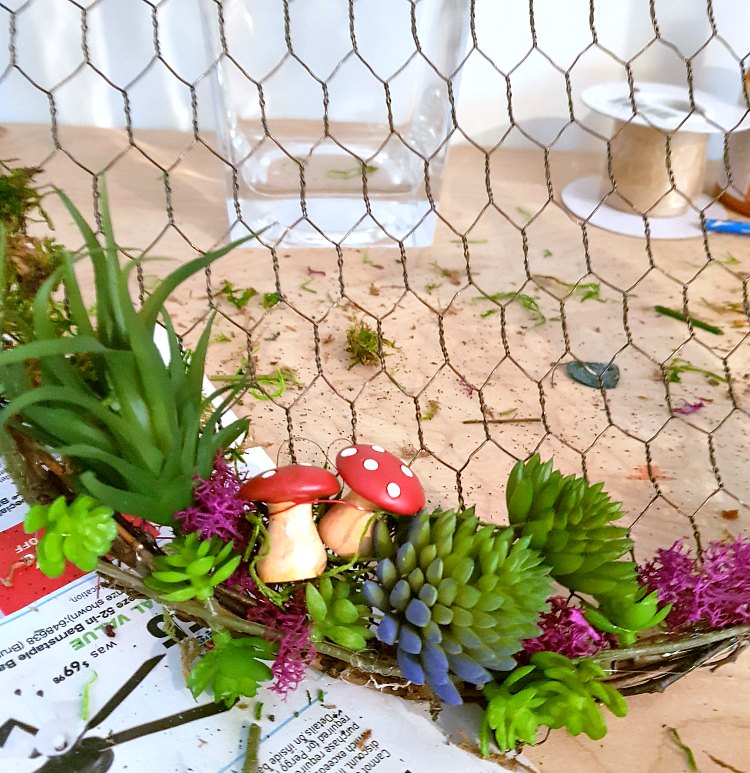 adding succulents, and accent embellishments to the spring-summer wreath. Full wreath tutorials at DearCreatives.com