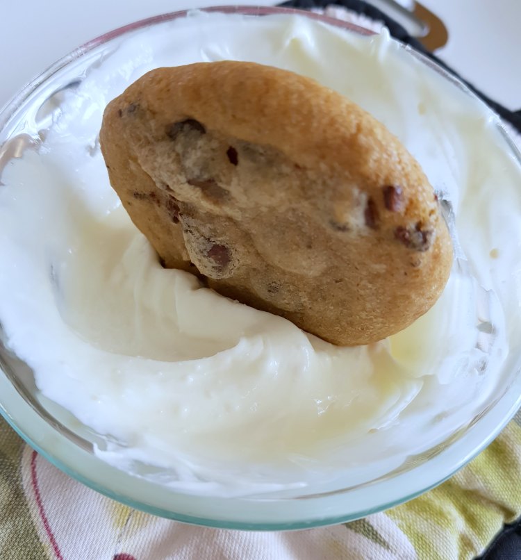 dipping a chocolate chip cookie in melted chocolate DearCreatives.com