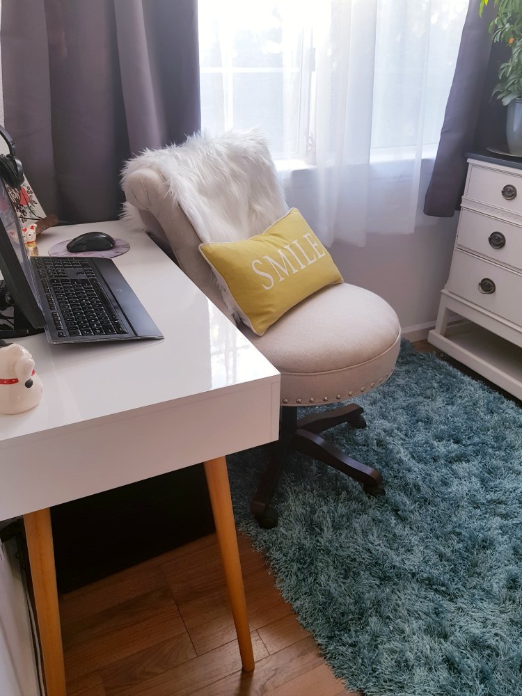 small corner office space newly decorated with a modern computer desk. DearCreatives.com