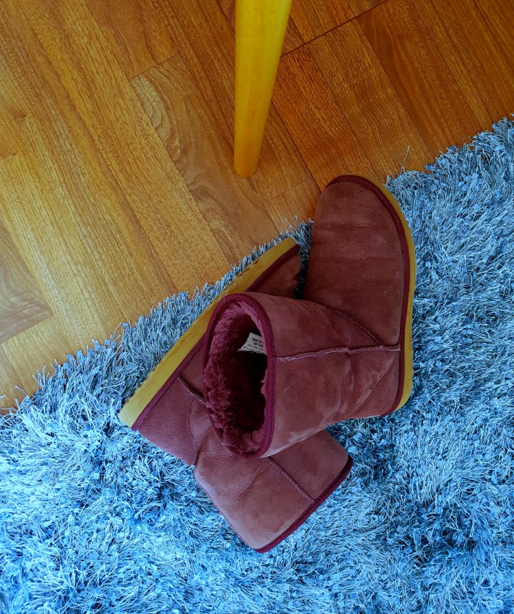teal shag rug, and ugg boots, wood floors, and natural wood desk leg © 2018 Theresa Huse DearCreatives.com